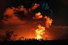 Visitors experience the new summit eruption at Kīlauea volcano in Hawaiʻi Volcanoes National Park.