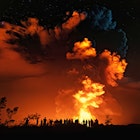 Visitors experience the new summit eruption at Kīlauea volcano in Hawaiʻi Volcanoes National Park.