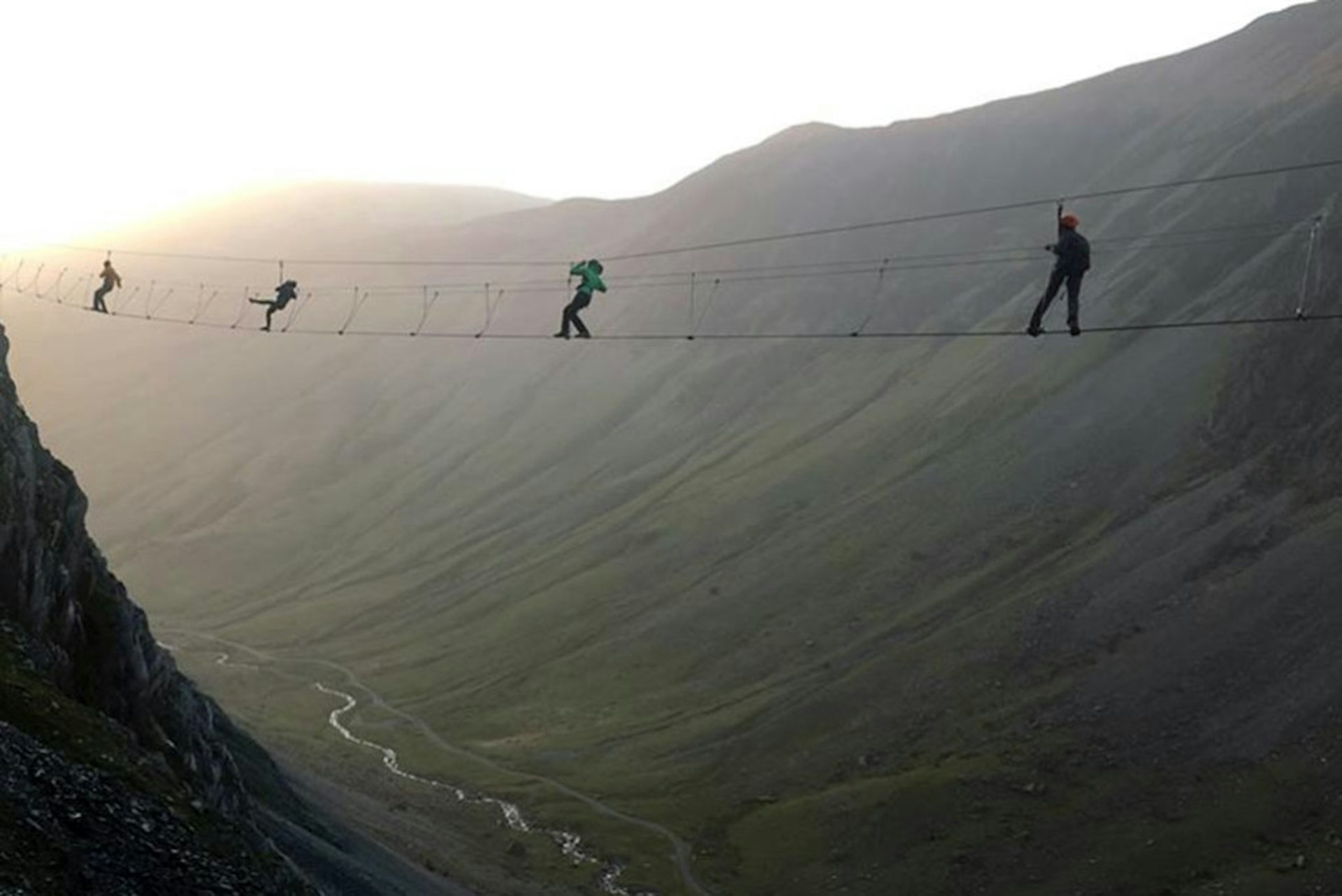 People crossing the Infinity Bridge at Honister in Cumbria