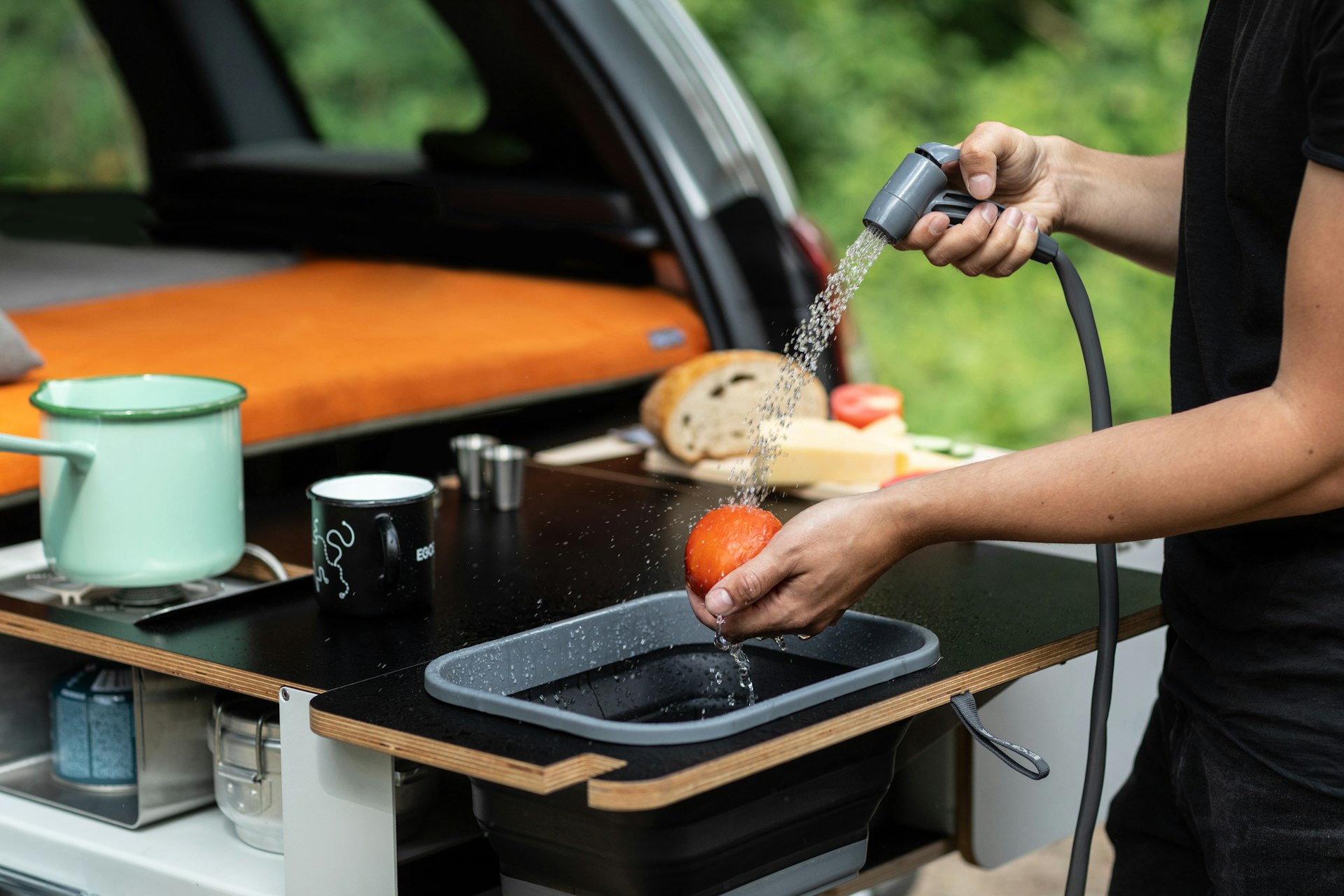 A modular camping kit in the trunk of a car