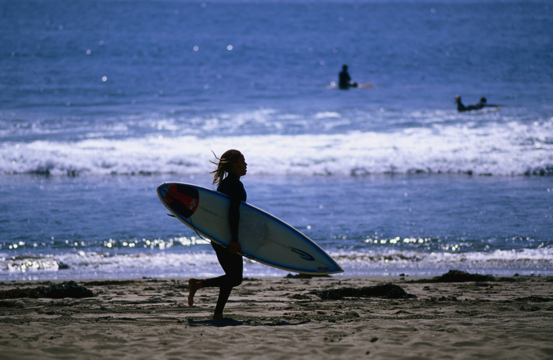A surfer runs to catch some Malibu wavesLPI-13779-150.jpg