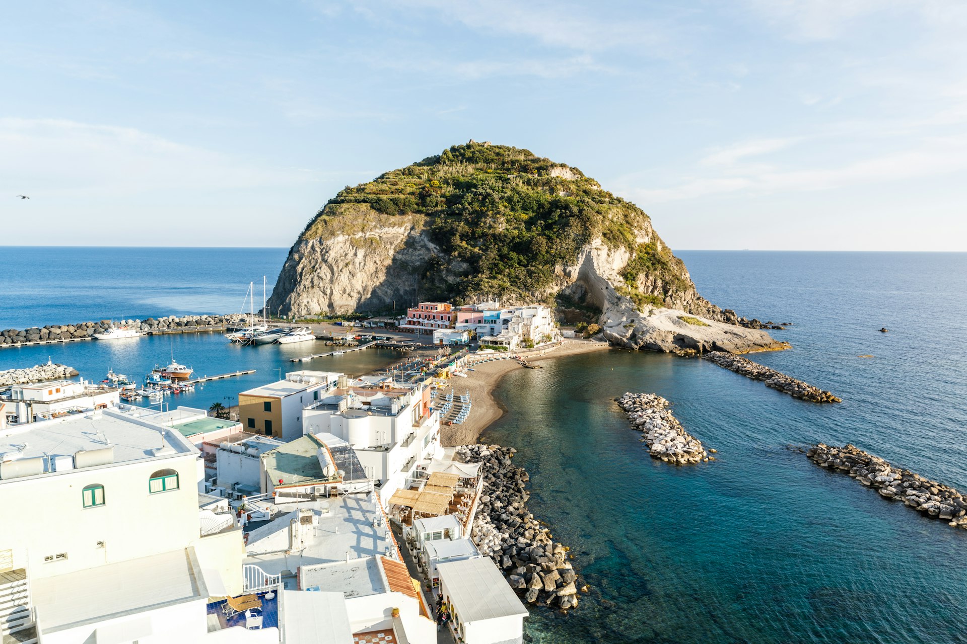 A beautiful coastal scene depicts an island outcrop in the sea 