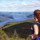 Woman Enjoying view from Black Mountain Summit overlooking Lake George, Adirondacks, New York