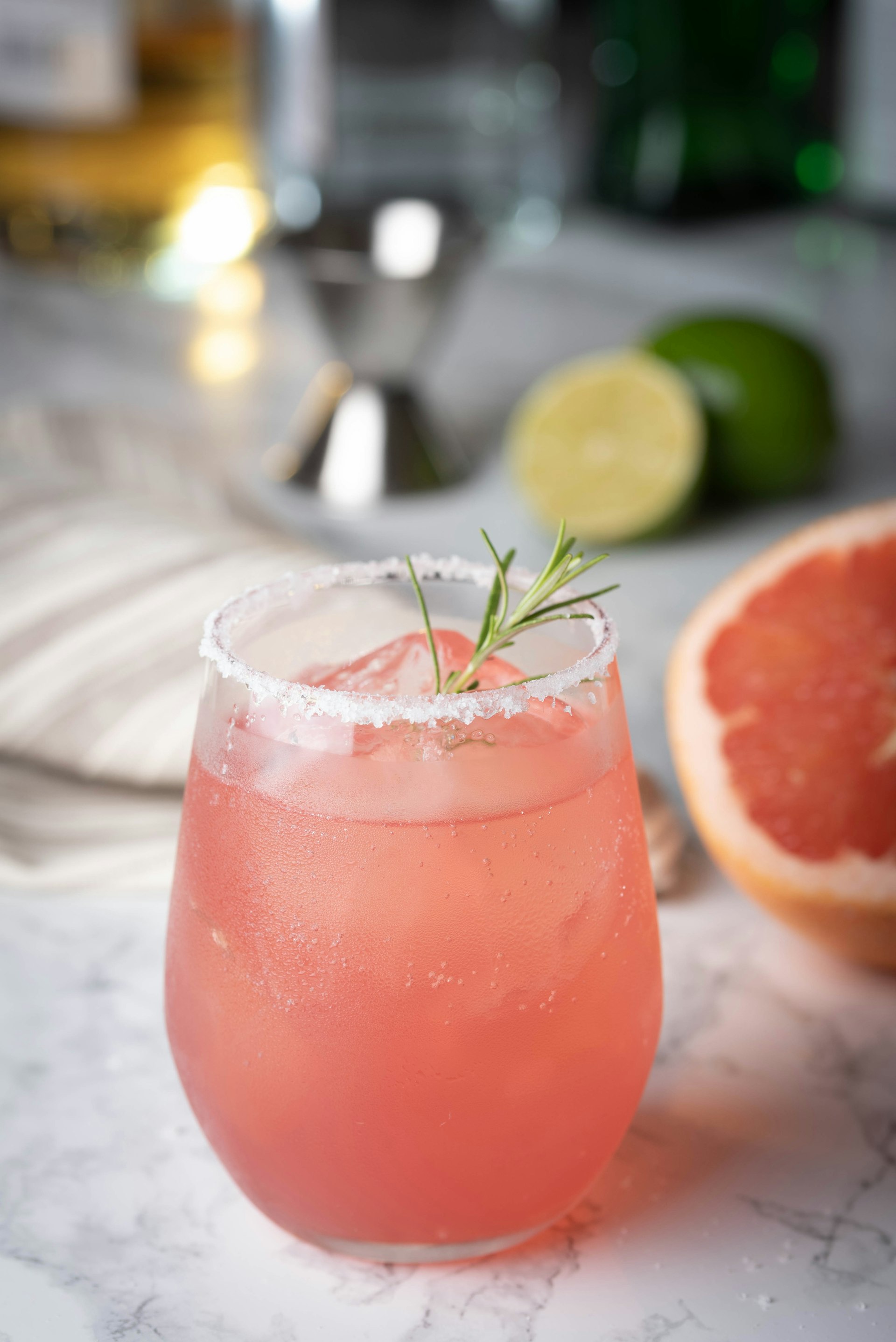 Paloma cocktail with grapefruit on marble background