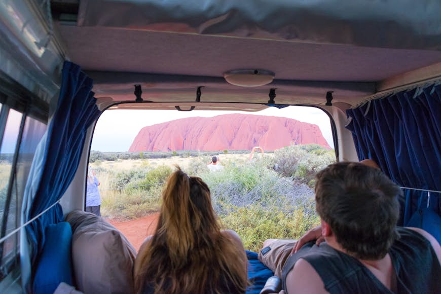 Uluru at sunset from back of the campervan 