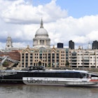 An Uber boat passes St Paul's cathedral in partnership with Thames clippers the boat tickets can be purchased via the ride hailing firm's app on August 3, 2020. (Photo by DANIEL LEAL-OLIVAS / AFP) (Photo by DANIEL LEAL-OLIVAS/AFP via Getty Images)