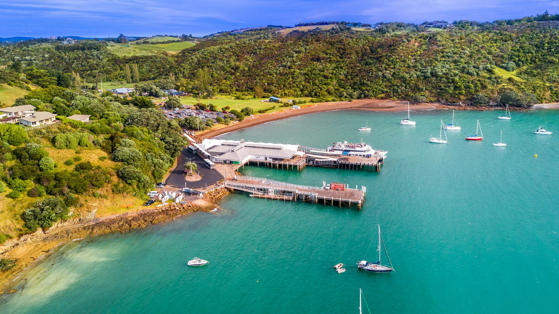 Aerial view of a small pier on Waiheke Island and a ferry ready for departure