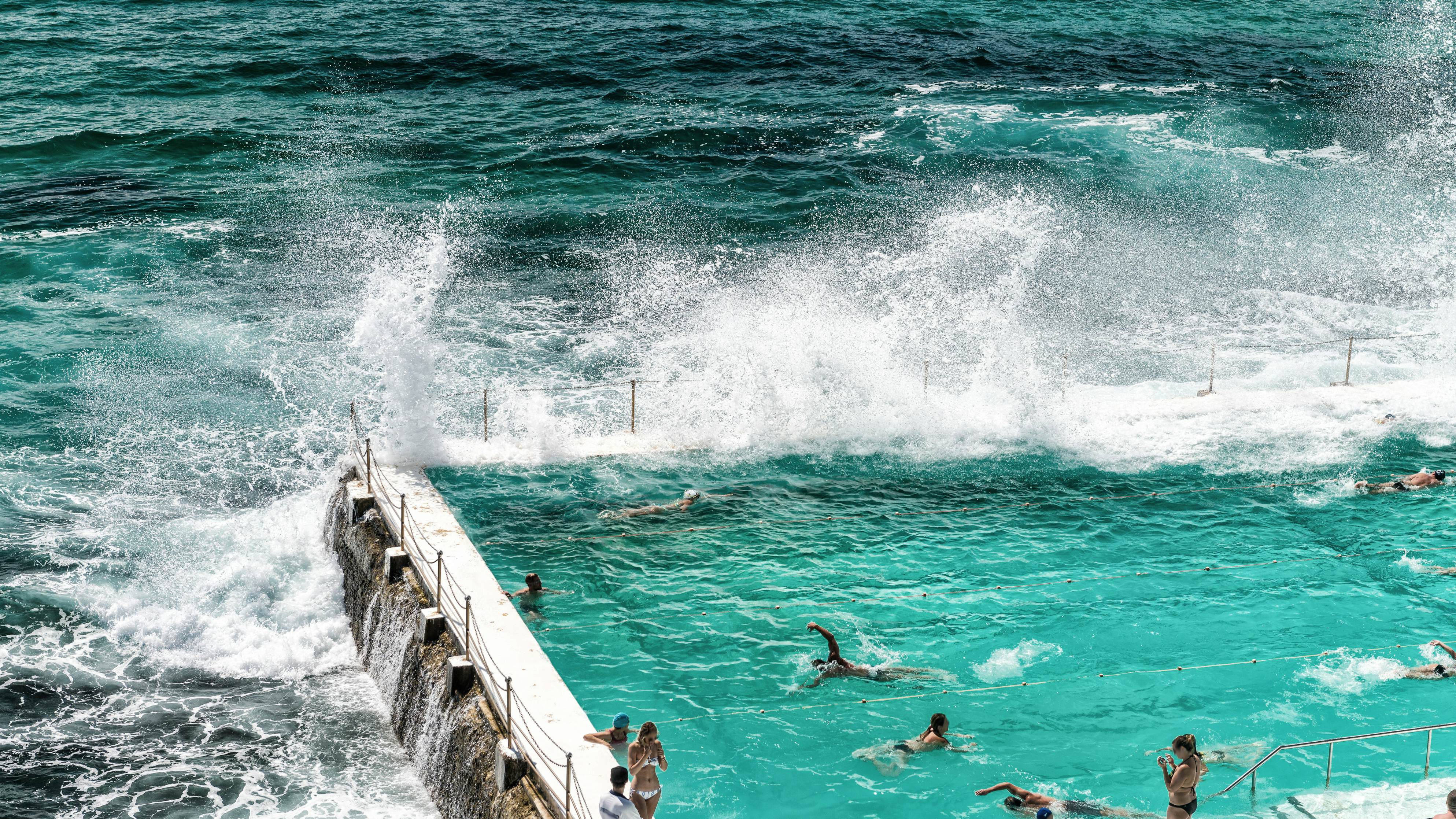 Beach Scene: Rock swimming pools on Pacific Ocean in Bondi, Sydney - Australia.