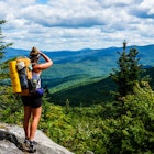 AUGUST 2015: An Appalachian Trail Thru-Hiker looks back at New Hampshire just before she crosses into Maine.
