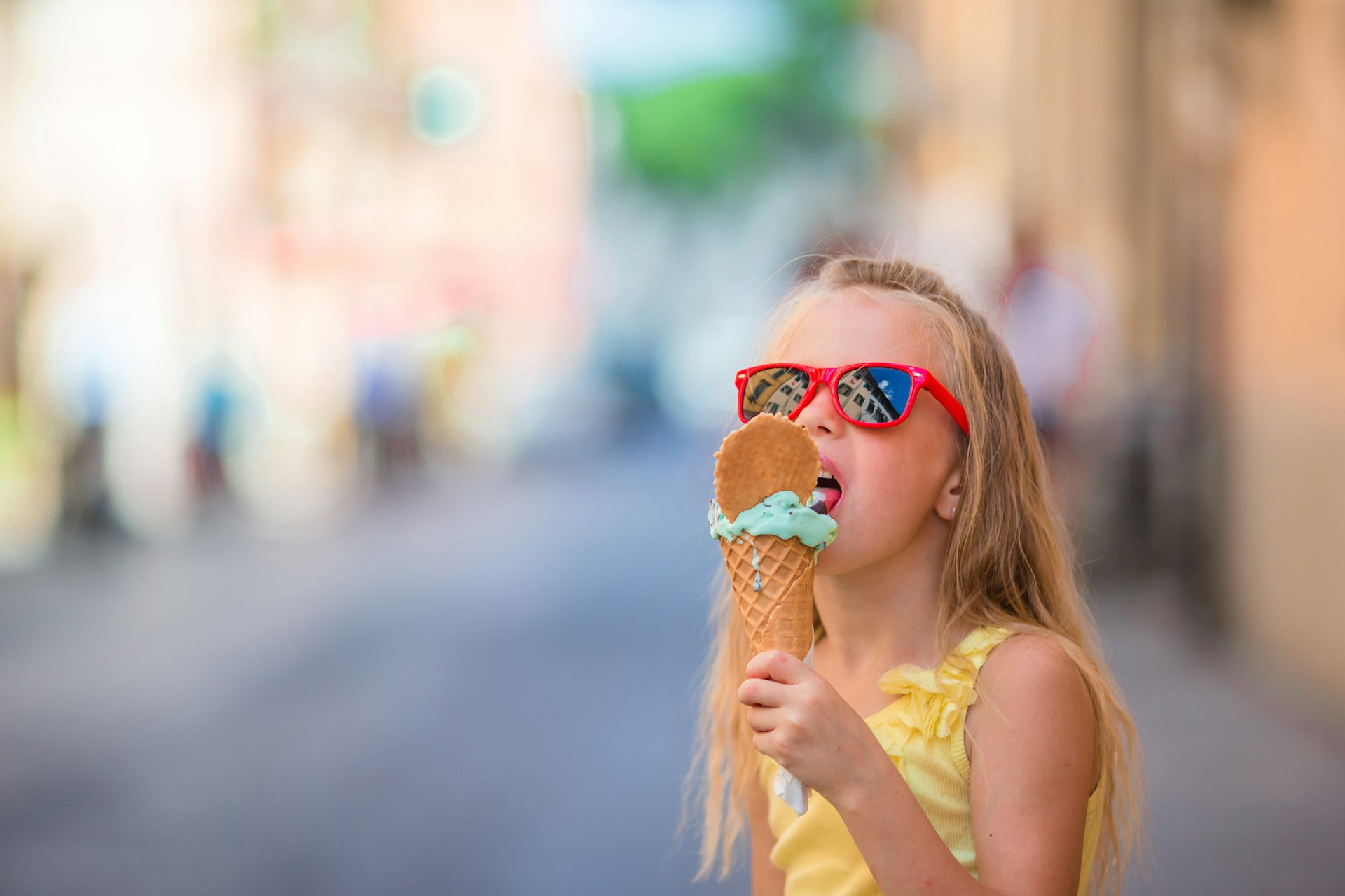 A girl eats gelato in Rome
