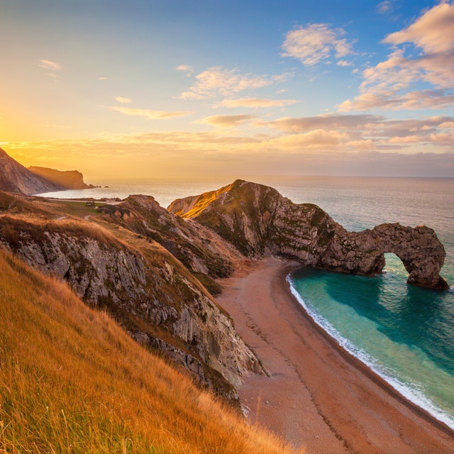 Sunrise behind Durdle Door, on the Jurassic Coast.