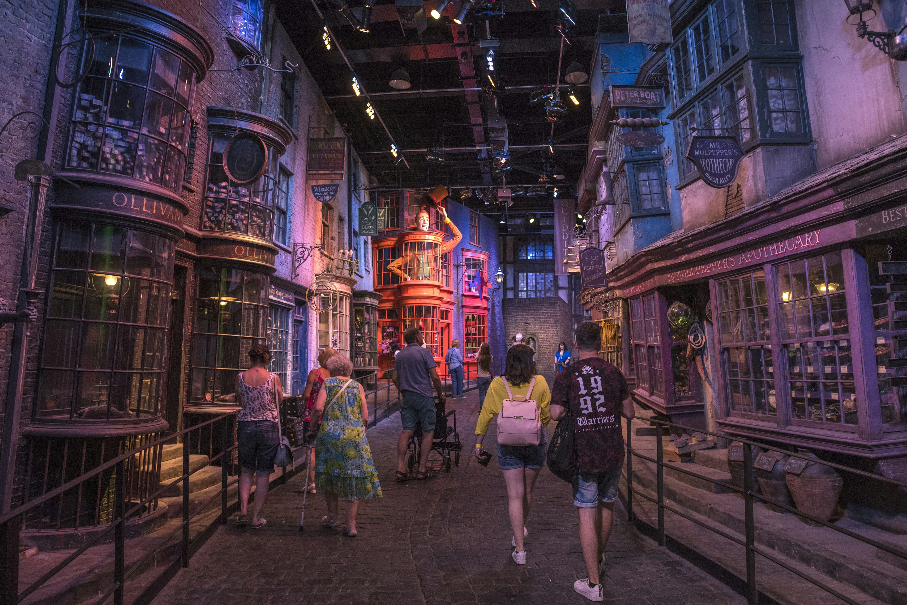 Visitors wander through the Diagon Alley movie set at the Harry Potter Studio tour in London