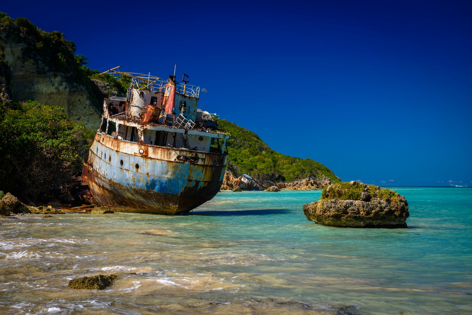 Shipwrecks in ruins on the shores of Sandy Ground Beach on the island of Anguilla