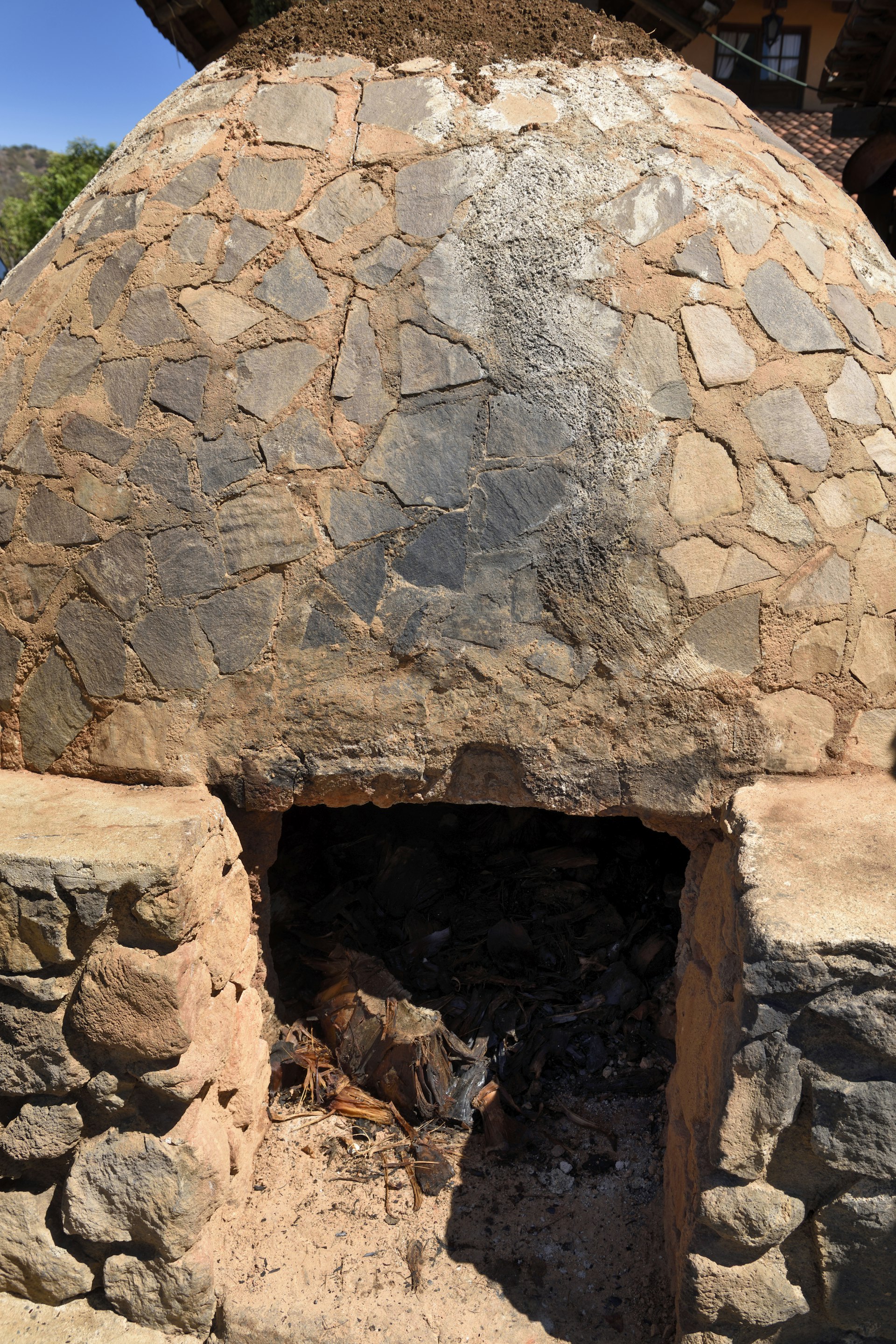 Stone beehive oven for cooking agave to make Tequila in Jalisco Mexico