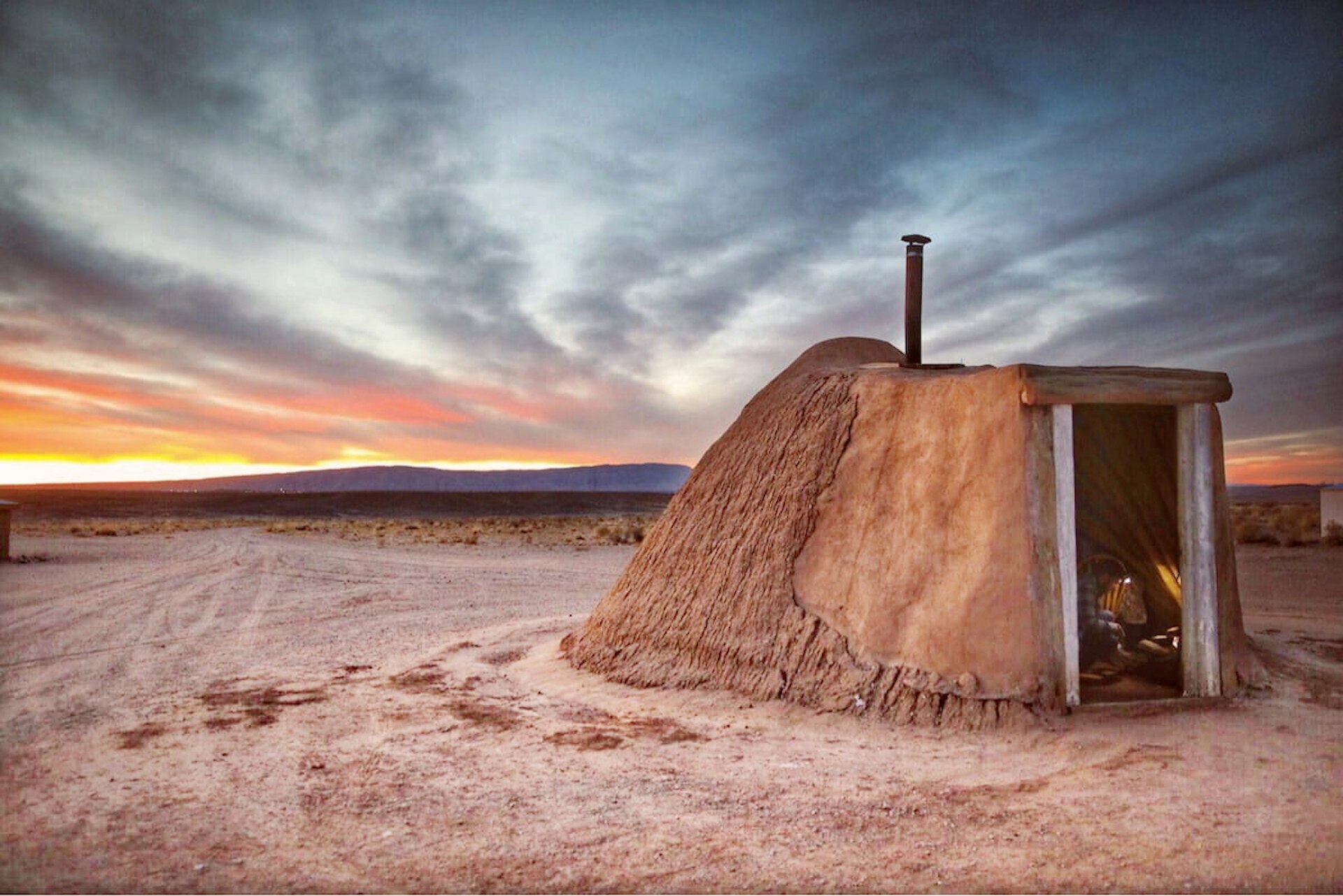 A home made of earth in a desert