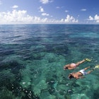 Models Cody Wagner and Katherine Wieland snorkeling at Grecian Rocks, Key Largo, a shallow reef, popular with visitors to the Florida Keys National Marine Sanctuary