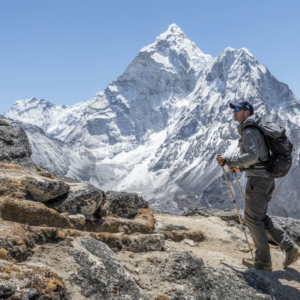 A male mountaineer walking at Dingboche.