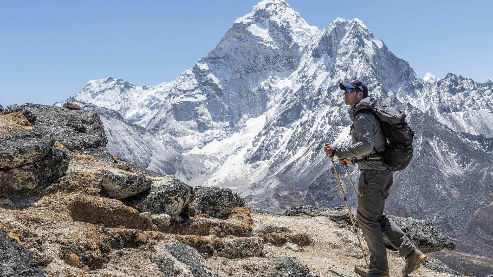 A male mountaineer walking at Dingboche.