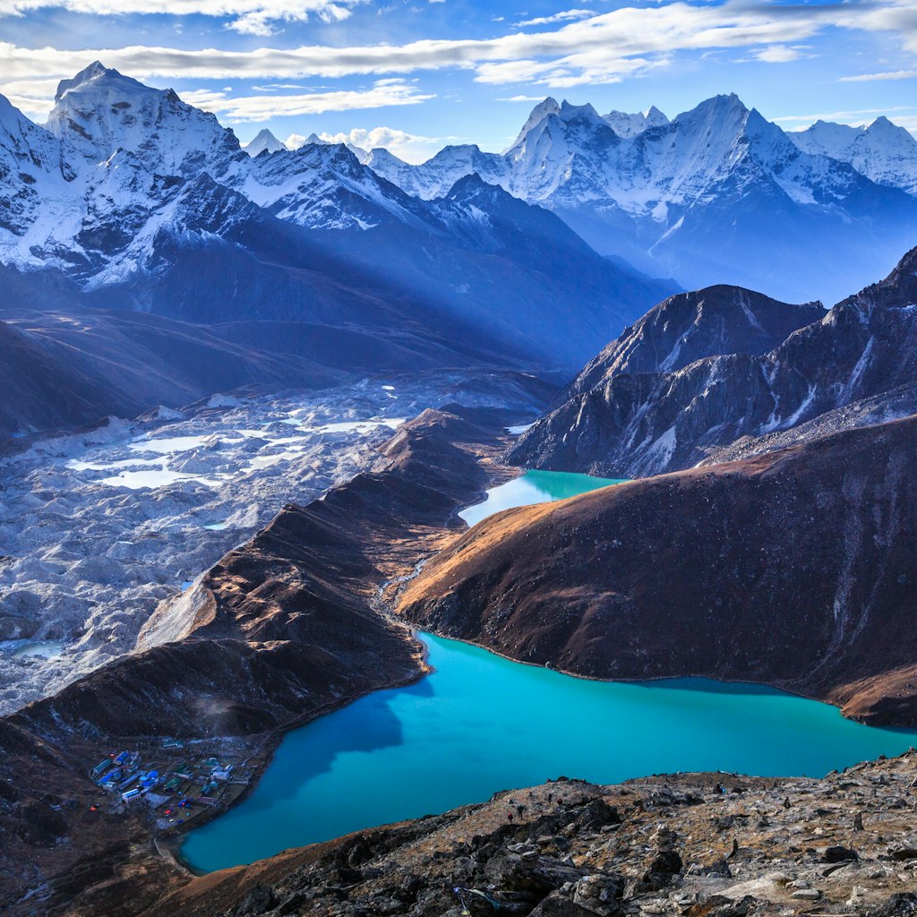 Stunning view of the Himalaya mountains (Cholatse and Taboche to the left), Ngozumpa glacier, and Gokyo lakes (the world's highest freshwater lakes, sacred for both Hindus and Buddhists), as seen on top of Gokyo Ri (5,357 m), near the village of Gokyo, in Sagarmatha National Park, UNESCO World Heritage Site in Khumbu region, Solukhumbu district, eastern Nepal, Asia.