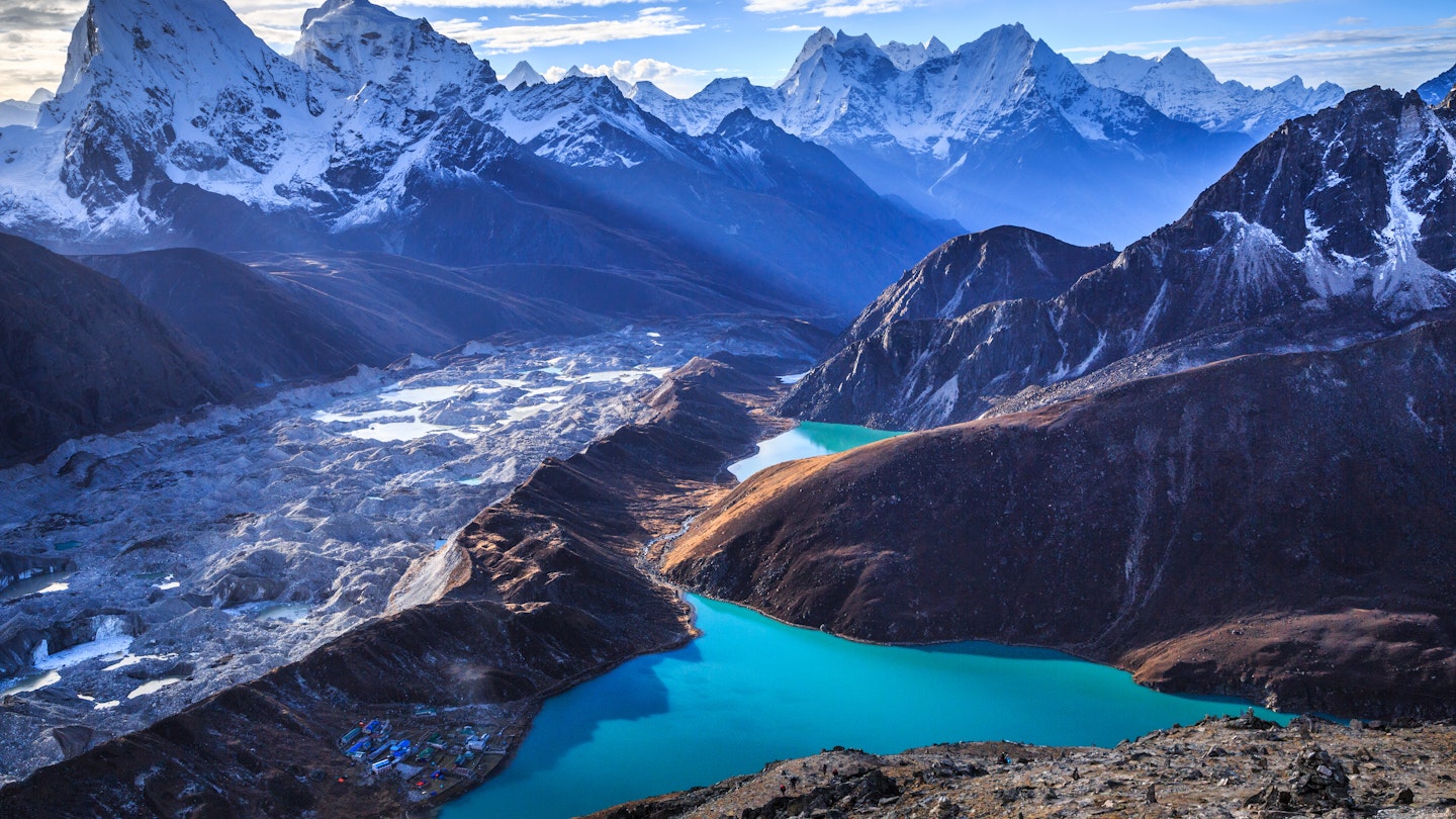 Stunning view of the Himalaya mountains (Cholatse and Taboche to the left), Ngozumpa glacier, and Gokyo lakes (the world's highest freshwater lakes, sacred for both Hindus and Buddhists), as seen on top of Gokyo Ri (5,357 m), near the village of Gokyo, in Sagarmatha National Park, UNESCO World Heritage Site in Khumbu region, Solukhumbu district, eastern Nepal, Asia.