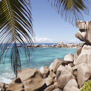 Smooth rocks on the shore at Anse Marron on La Digue Island.