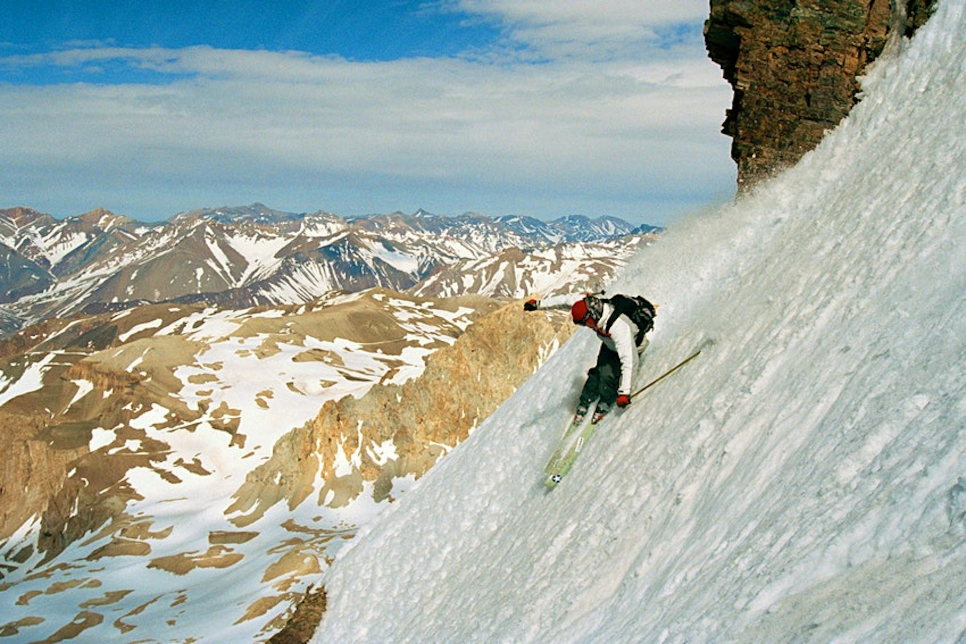 A skier descends down a very steep mountain in Las Lenas, Argentina 