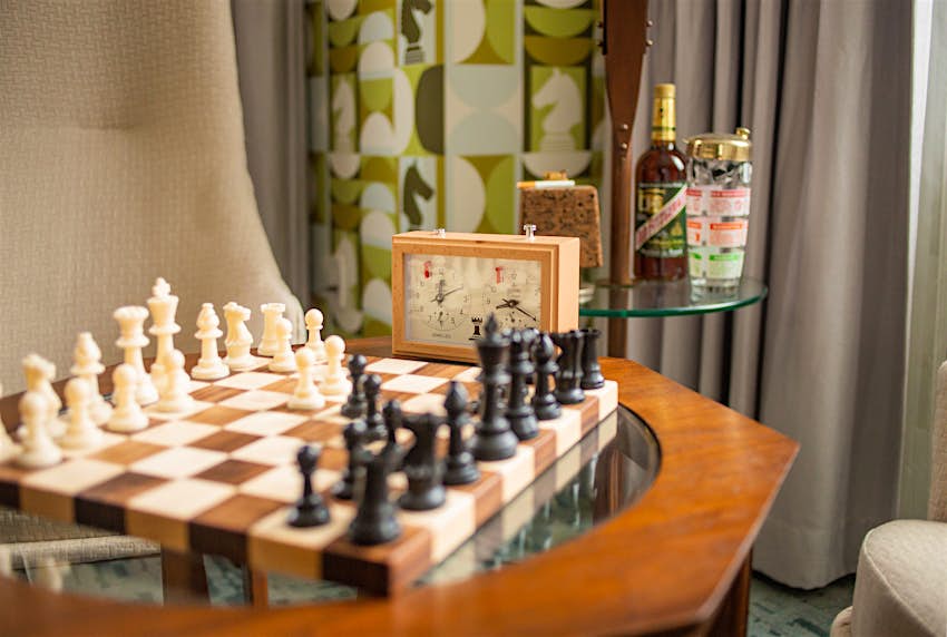 This Queen’s Gambit-motivated hotel home capabilities chess parts on the ceiling