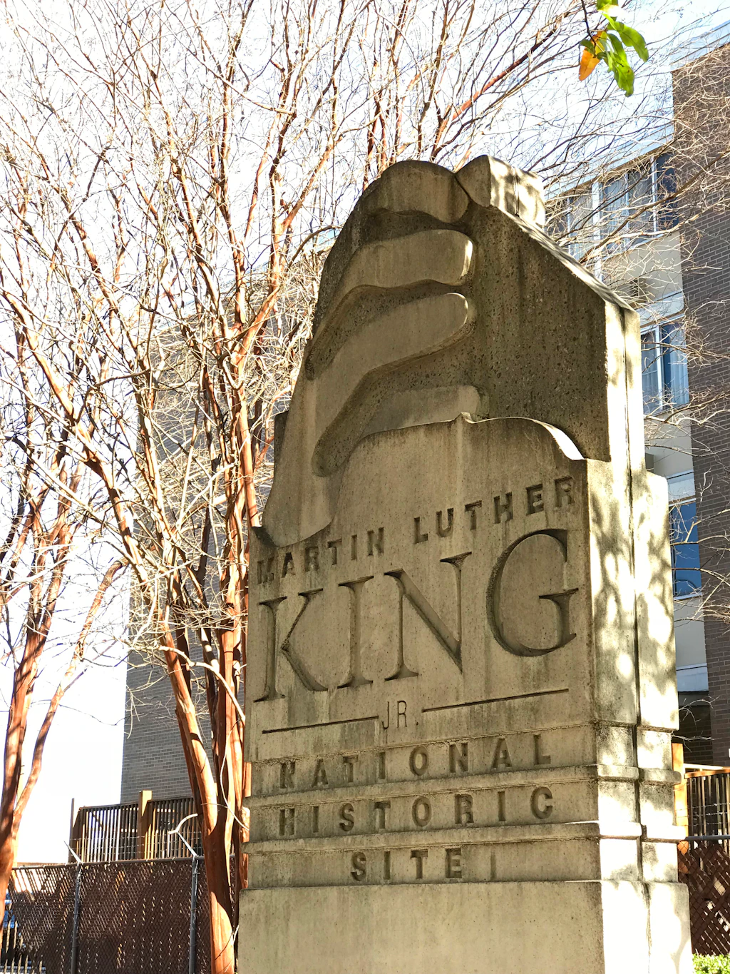 A large white stone marker engraved with "Martin Luther King Jr. National Historic Site"