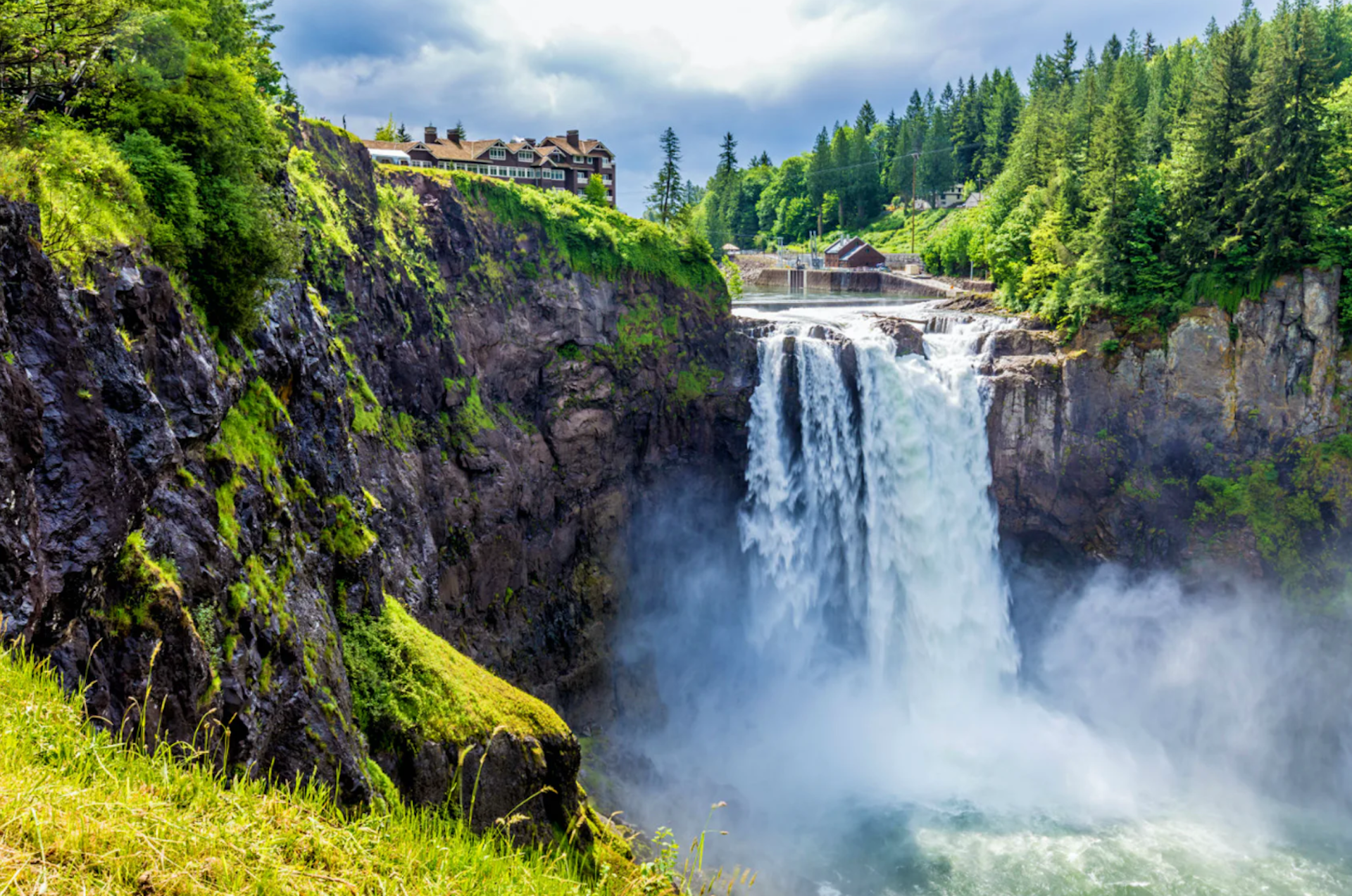 A gushing waterfall drops into a canyon.