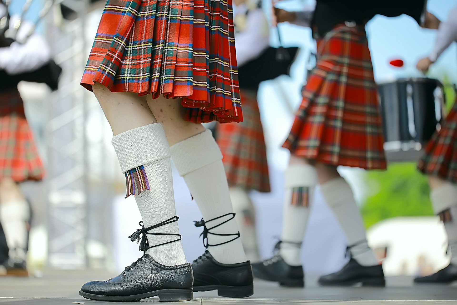 Legs and Scottish kilt-wearing men