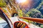 Car on road in Piva Canyon, National Park Montenegro and Bosnia and Herzegovina, Balkans, Europe. Beauty world.