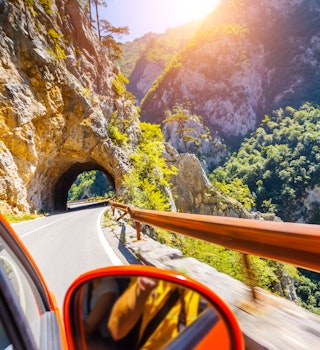 Car on road in Piva Canyon, National Park Montenegro and Bosnia and Herzegovina, Balkans, Europe. Beauty world.