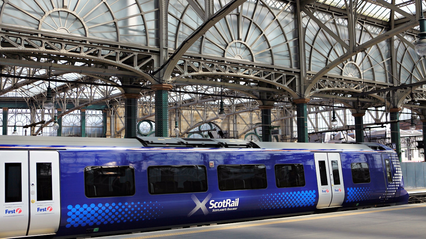 GLASGOW, SCOTLAND, UK - JULY 12, 2013: A ScotRail train at the platform at Queen Street station in Glasgow. Glasgow Central Station was opened on 31 July 1879.