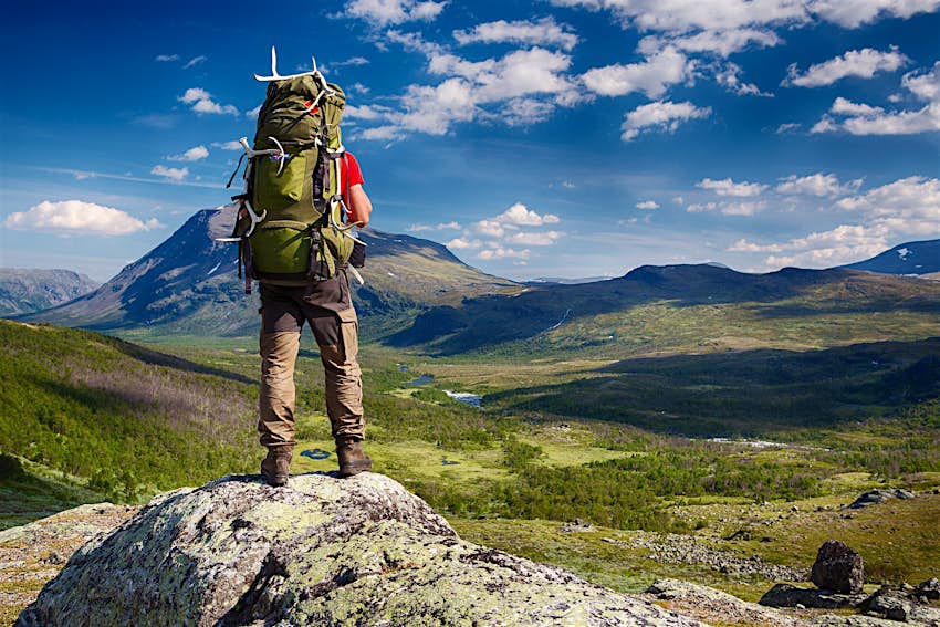 Hiker with a backpack in the wilderness of northern Sweden