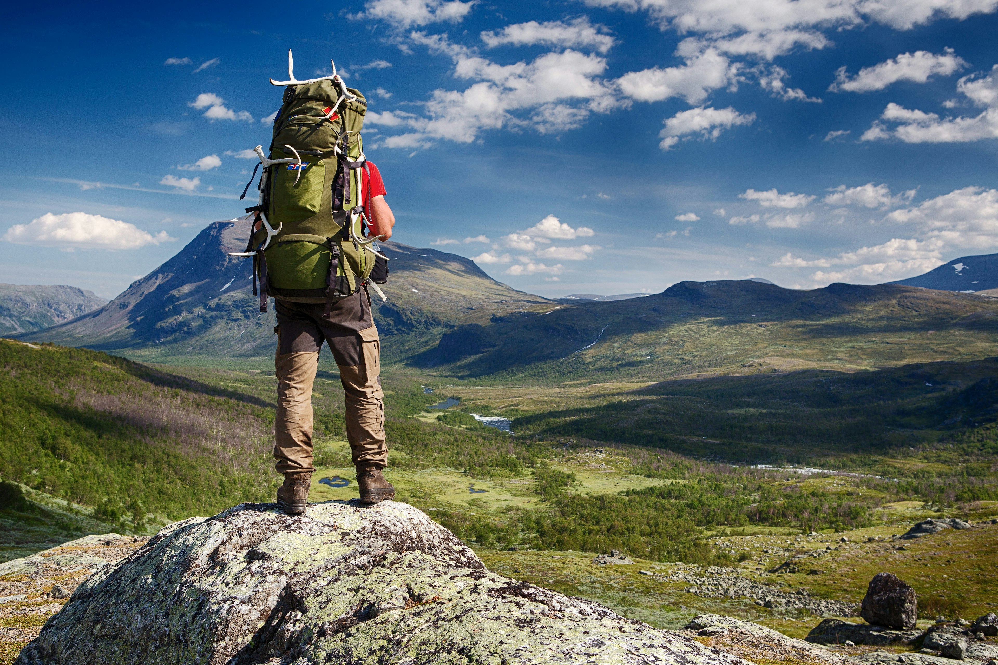 Hiker with backpack in the wilderness of northern Sweden