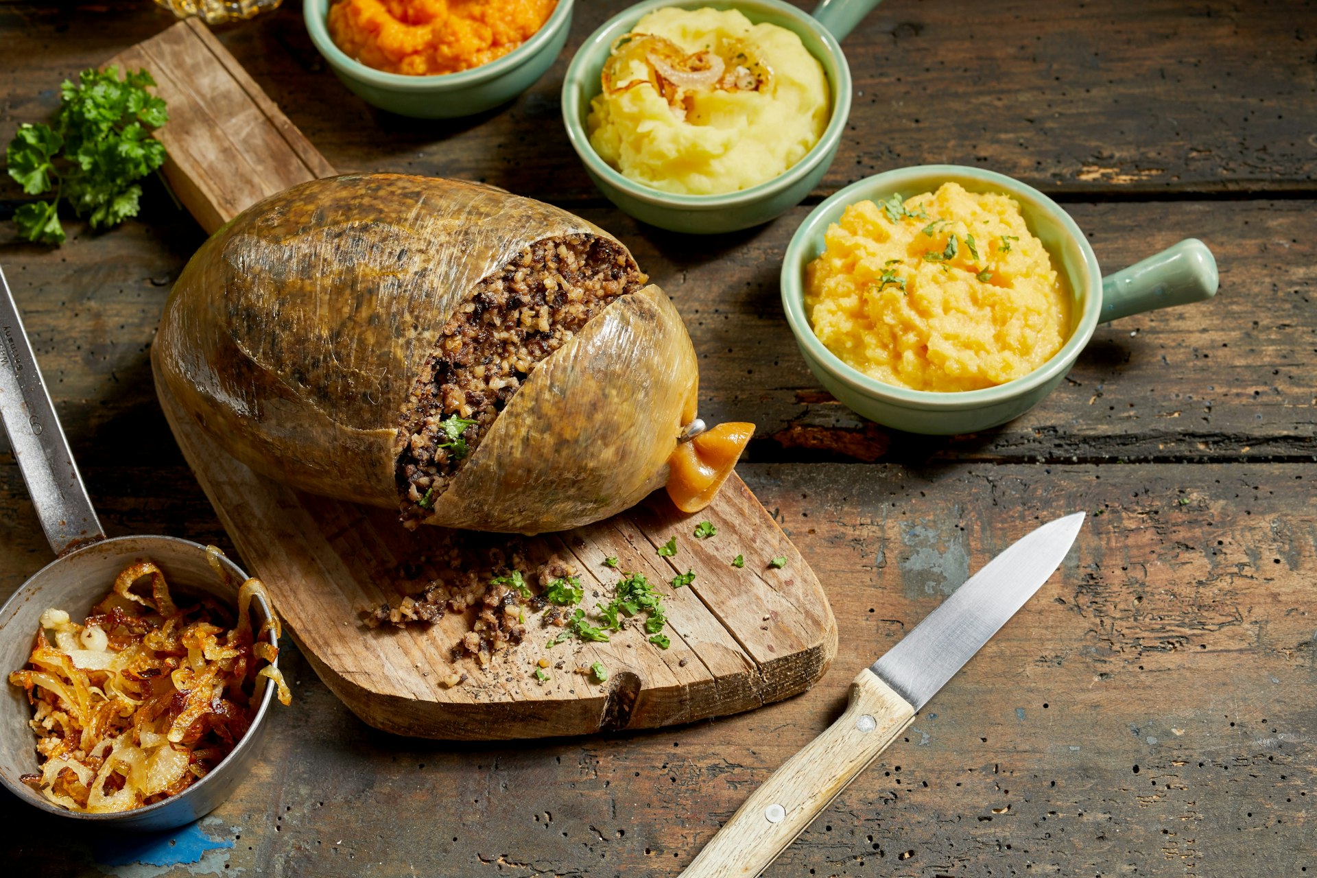 Traditional haggis meal for Robert Burns Supper, a Scottish tradition with cooked sliced haggis, neeps, tatties, onion and carrot