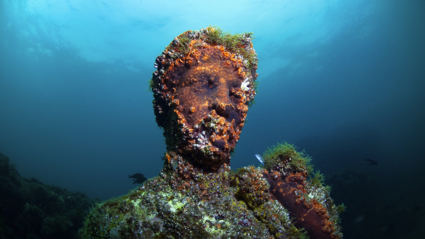 Submerged roman statue. Underwater ancient Roman ruins. Baia (Baiae), Campi Flegrei (Phlegraean Fields), Naples, Campania, Italy