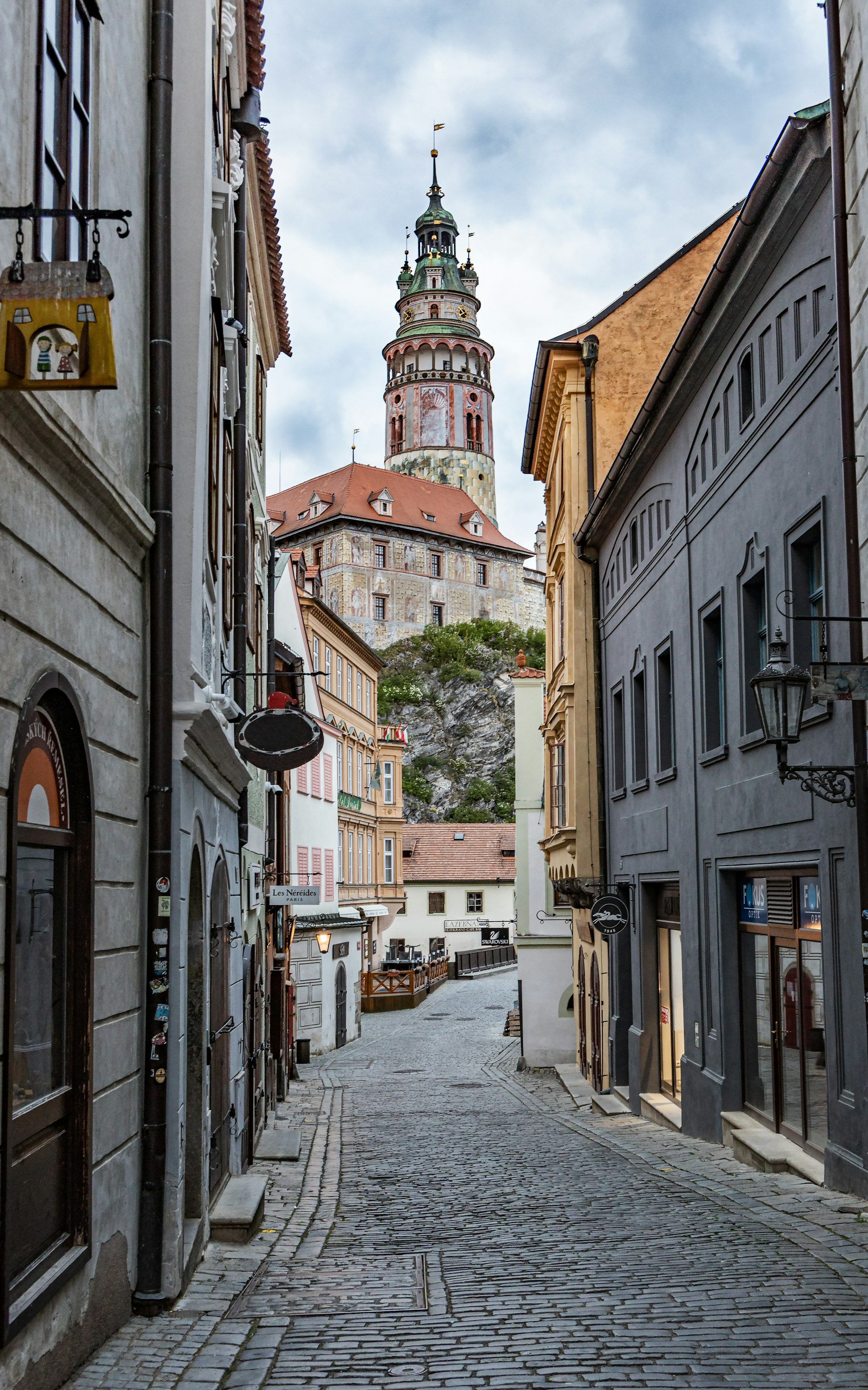 View of the Tower of the Krumlov castle from narrow street in Prague city centre