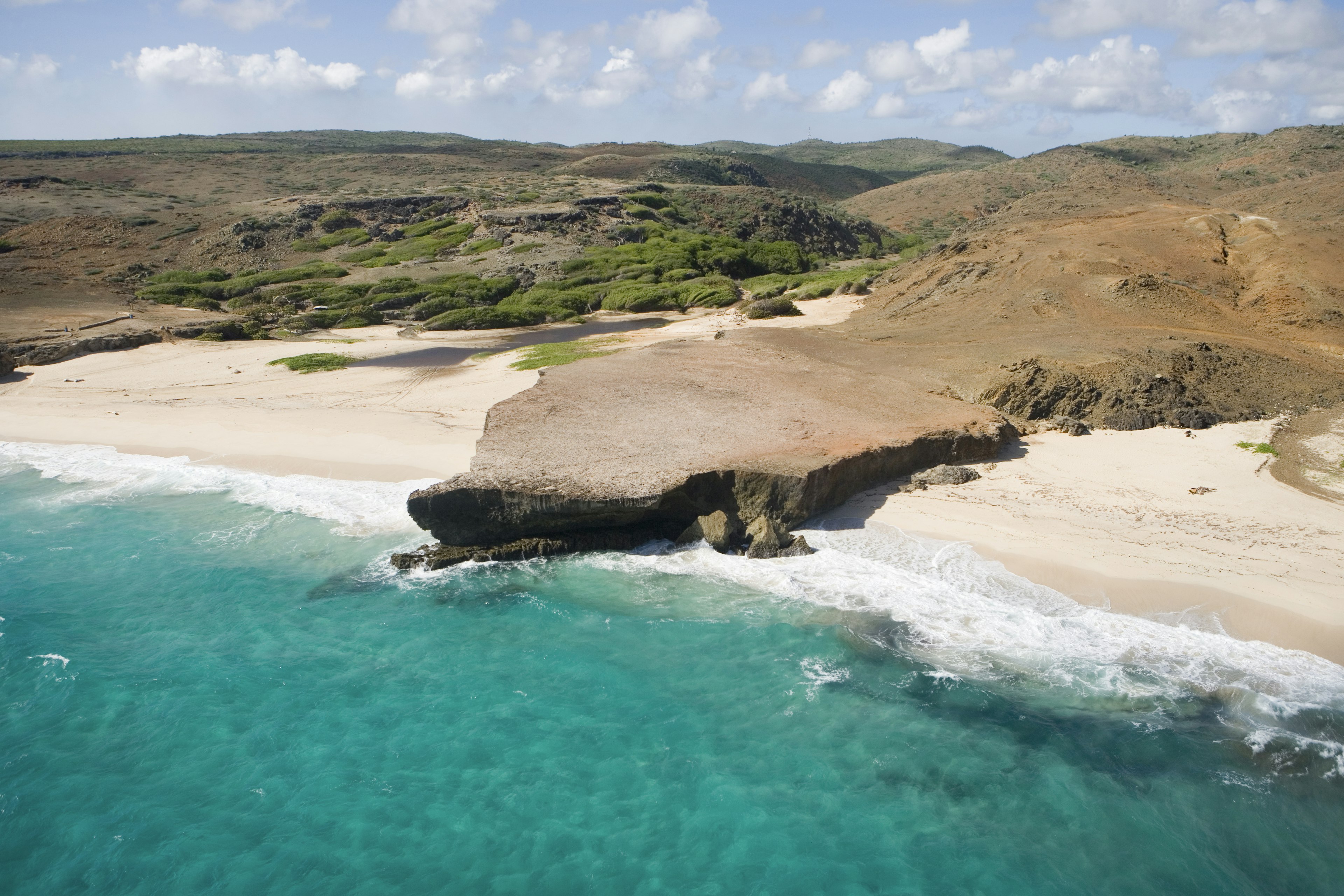 Aerial of Dos Playa beach of coastline on eastern side of island, near Oranjestad, Aruba