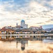 Esztergom, Hungary, Europe. Basilica of the Blessed Virgin Mary. Amazing morning view over Danube river, beautiful reflections mirrored in water. Long exposure landscape.