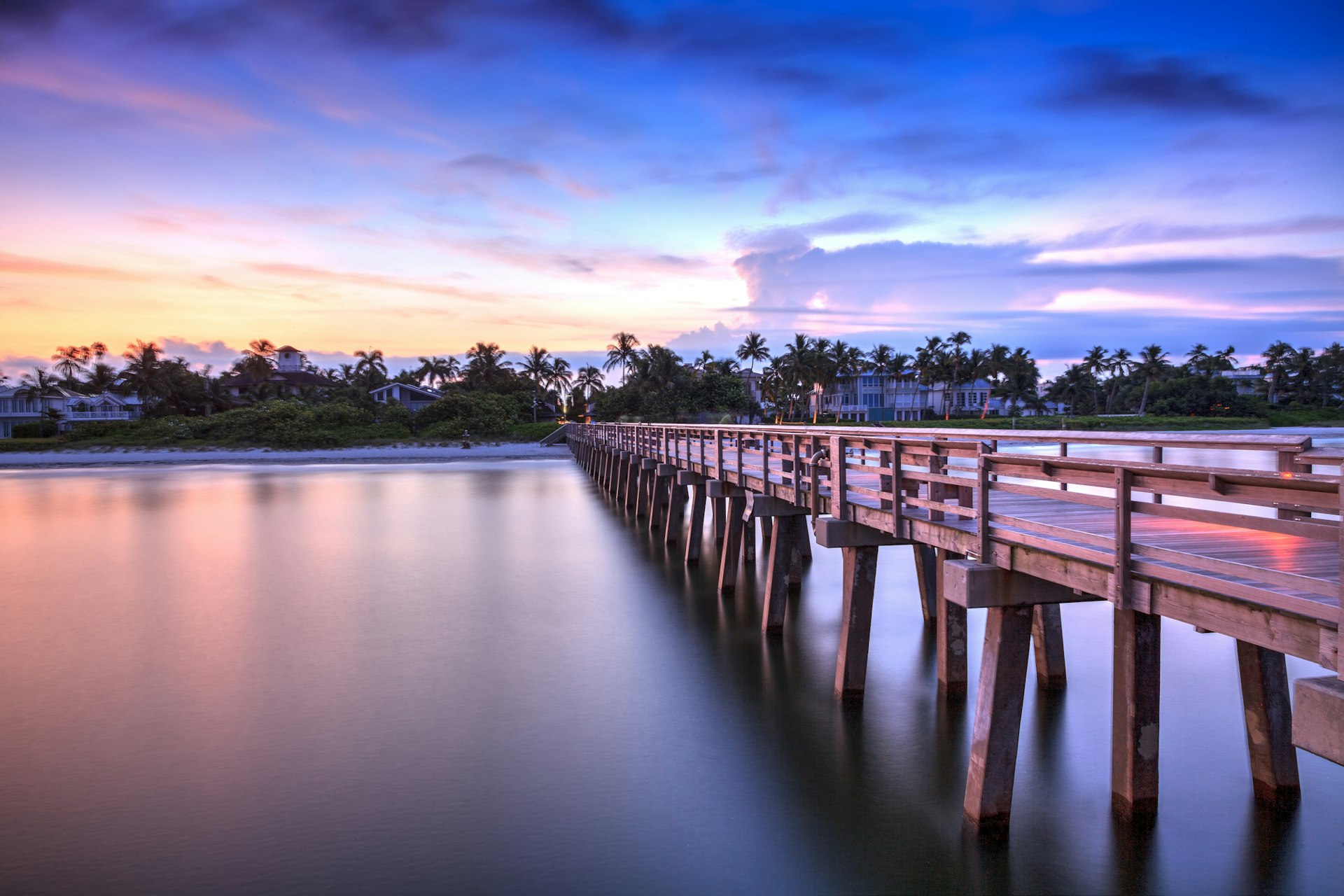 A pier over the water at sunset