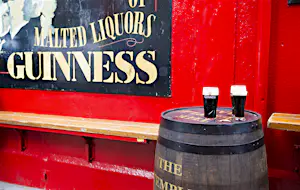 Dublin, Ireland - May 31, 2013: Pints of Guinness beer sit on a barrel outside Temple Bar, established in 1840 and located in the Temple Bar district of Dublin.