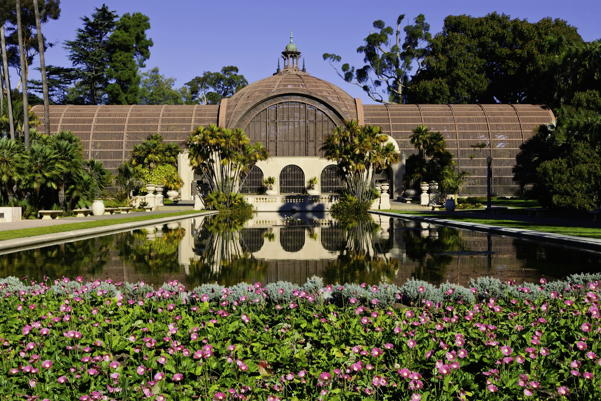 Cottage reflected in a lake, Balboa Park, San Diego