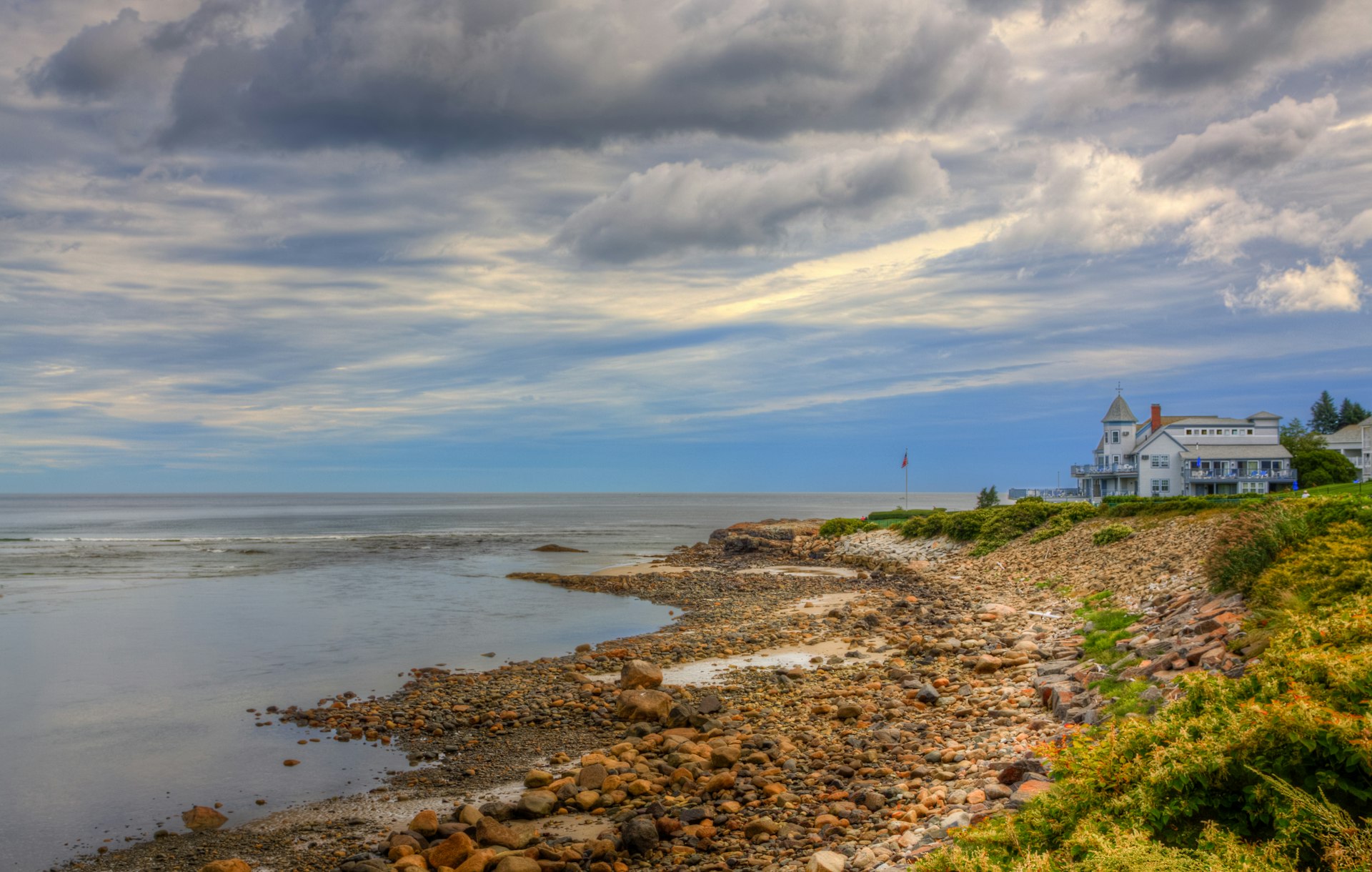 The Marginal Way in Ogunquit on a cloudy autumn day, with a hotel in the distance. 