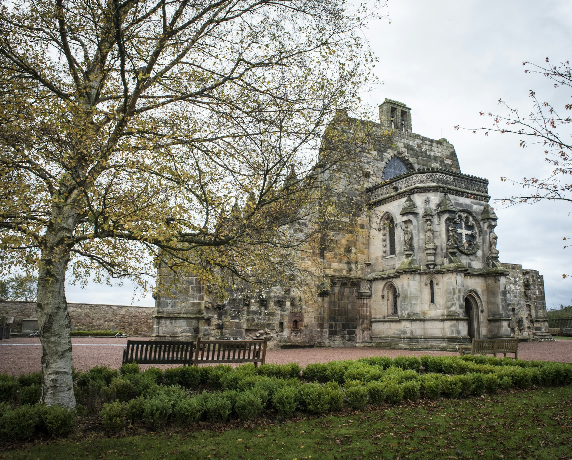 Rosslyn Chapel near Edinburgh, Scotland as pictured behind trees