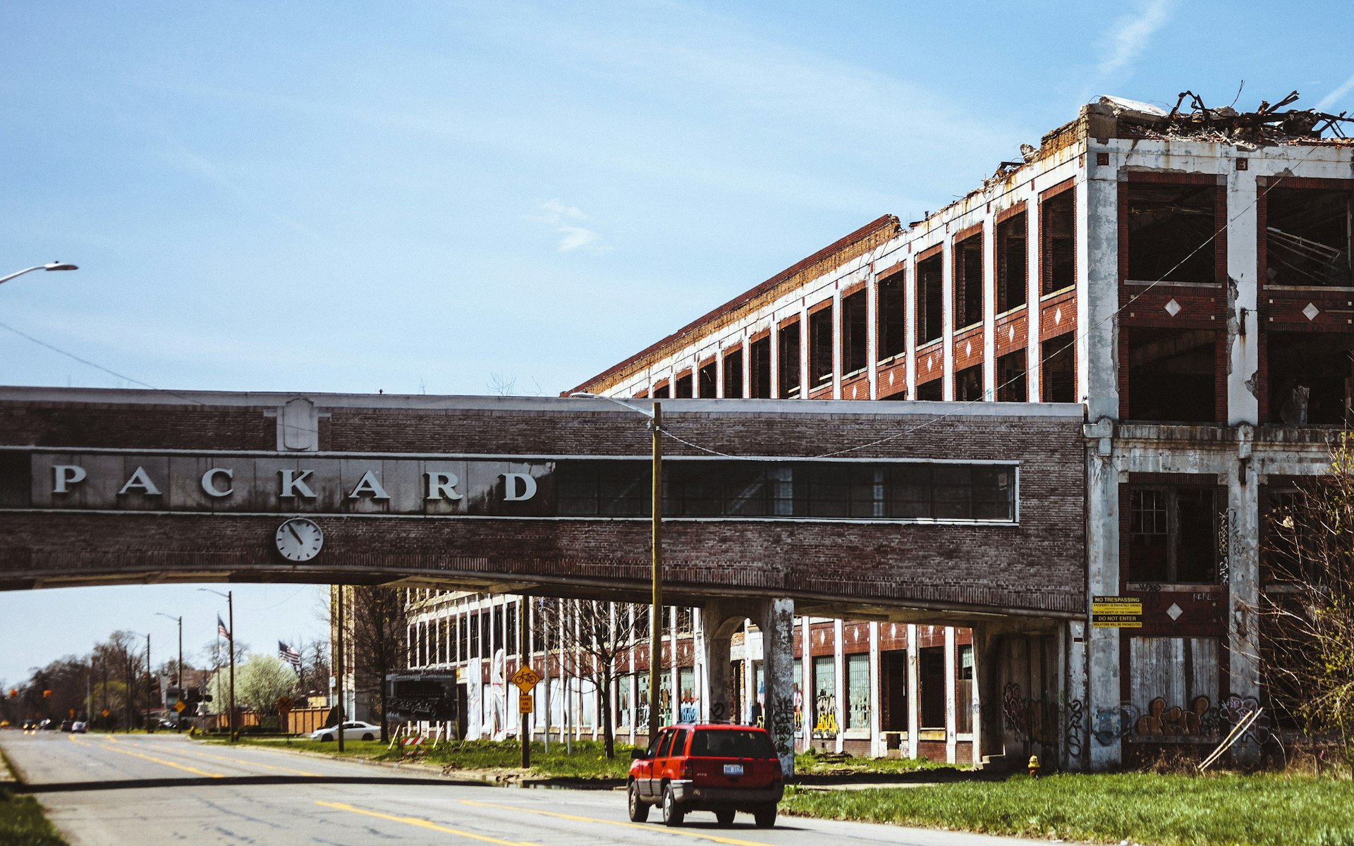 A car passing by the famous abandoned Packard plant in Detroit. 