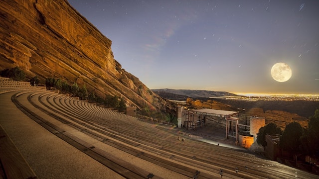 Denver's Red Rocks venue in the foreground, exploits the full moon as the main event.