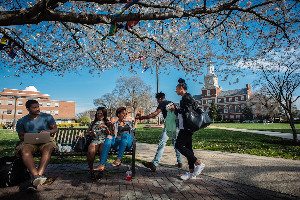 WASHINGTON, DC -- MARCH 18: From left: freshman Tevin Heath, and juniors Ambriel Weatherly, Brianna Brown, David Nesbeth and Shelice Dwyer socialize between classes on the Yard. .Founded in 1867, Howard University is one of the elite HBCU's in the country, but revenue and administration problems plague the instititution and threaten its status. (photo by Andre Chung for The Washington Post via Getty Images)