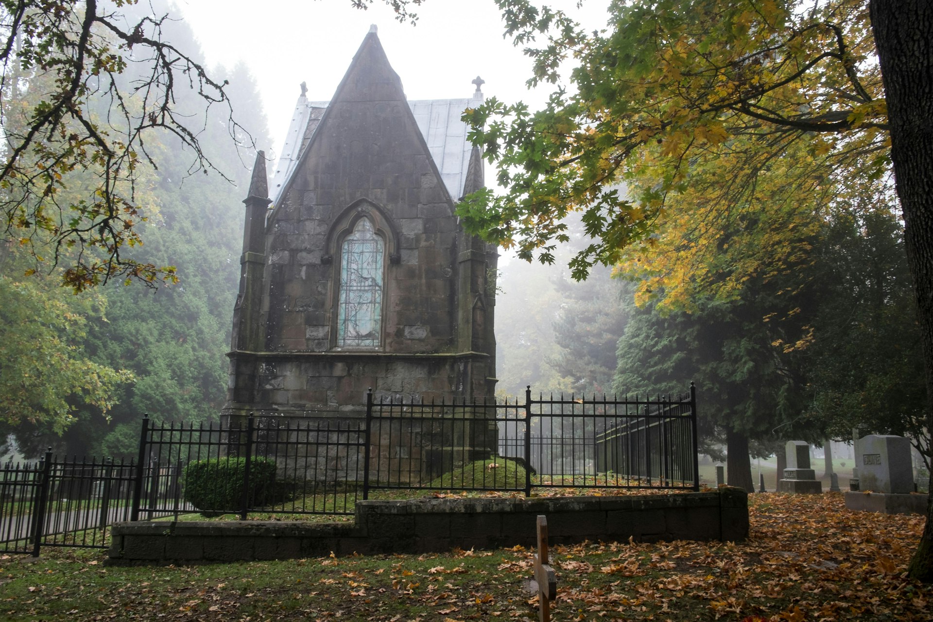 Mausoleum in a foggy old Pioneer Cemetery covered