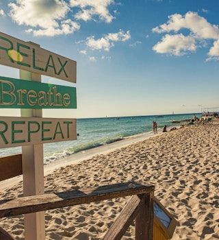 Relax Breathe Repeat sign in Dominicus beach